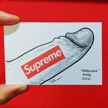 A sketch on card of a penis with the Supreme logo down the side